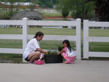 Kasen helping Mommy plant flowers